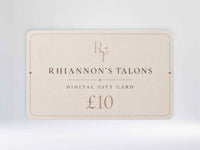 A Rhiannon's Talons digital gift card for £10, shown as a cream-colored rectangular card with elegant gold typography and a thin decorative border, set against a soft light gray background.