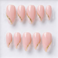 Ten-piece press-on nail set arranged in two rows on a clear display card against a white background. The nails are glossy pale pink with a diagonal glittery gold accent and a textured glitter tip.