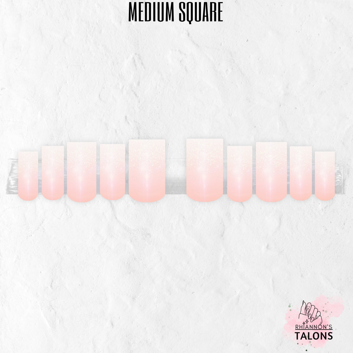 Glossy nude and white ombré press-on nails with subtle glitter French fade in medium square shape.
