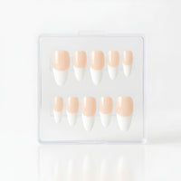 A set of ten coffin press-on nails in a clear plastic case, featuring a classic glossy white French manicure with a pale peach nude base.