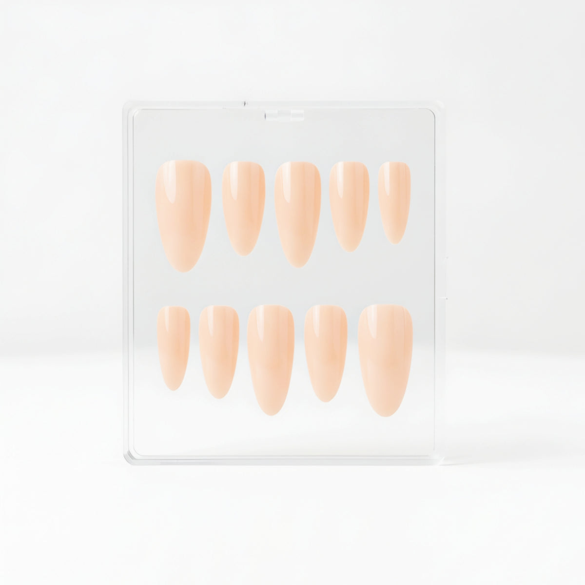 Ten nude Glossy beige almond press-on nails, displayed inside a clear plastic case against a clean white background.