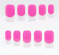 A set of press-on nails displayed on clear plastic hangers, featuring a vibrant hot pink color base and white french tips.