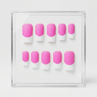 A set of ten press-on nails with a pink and white French tip design, displayed inside a clear acrylic case on a white background.