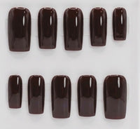 Ten glossy dark brown press-on nails arranged in two rows on a plain white background.