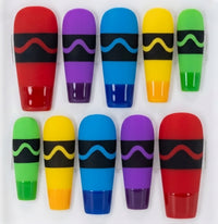 Ten coffin crayon themed press-on nails arranged in two rows on a white background, each in a different bright color with a black band and a wavy accent stripe.