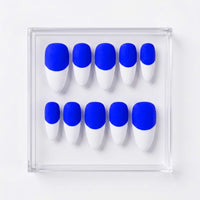 A set of ten false press-on nails arranged in two rows inside a clear square display case on a white background. The nails have a bold two-tone design with a neon royal blue base and white french tips