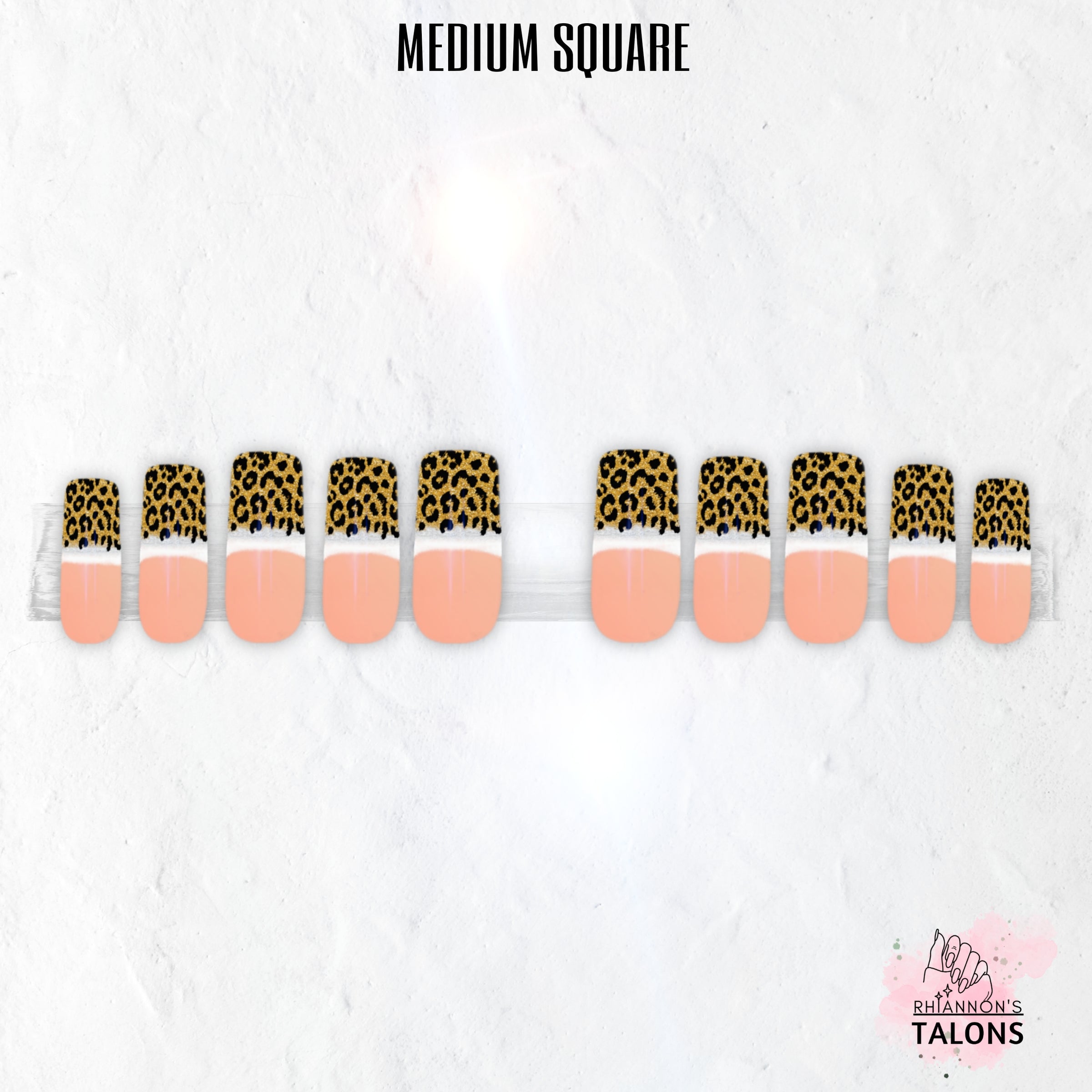 Fierce French gold leopard print French tip nails