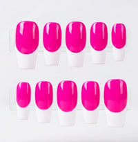 Ten press-on nails arranged in two rows of five, featuring a glossy neon pink base and  white french tips displayed on clear plastic stands against a light gray background.