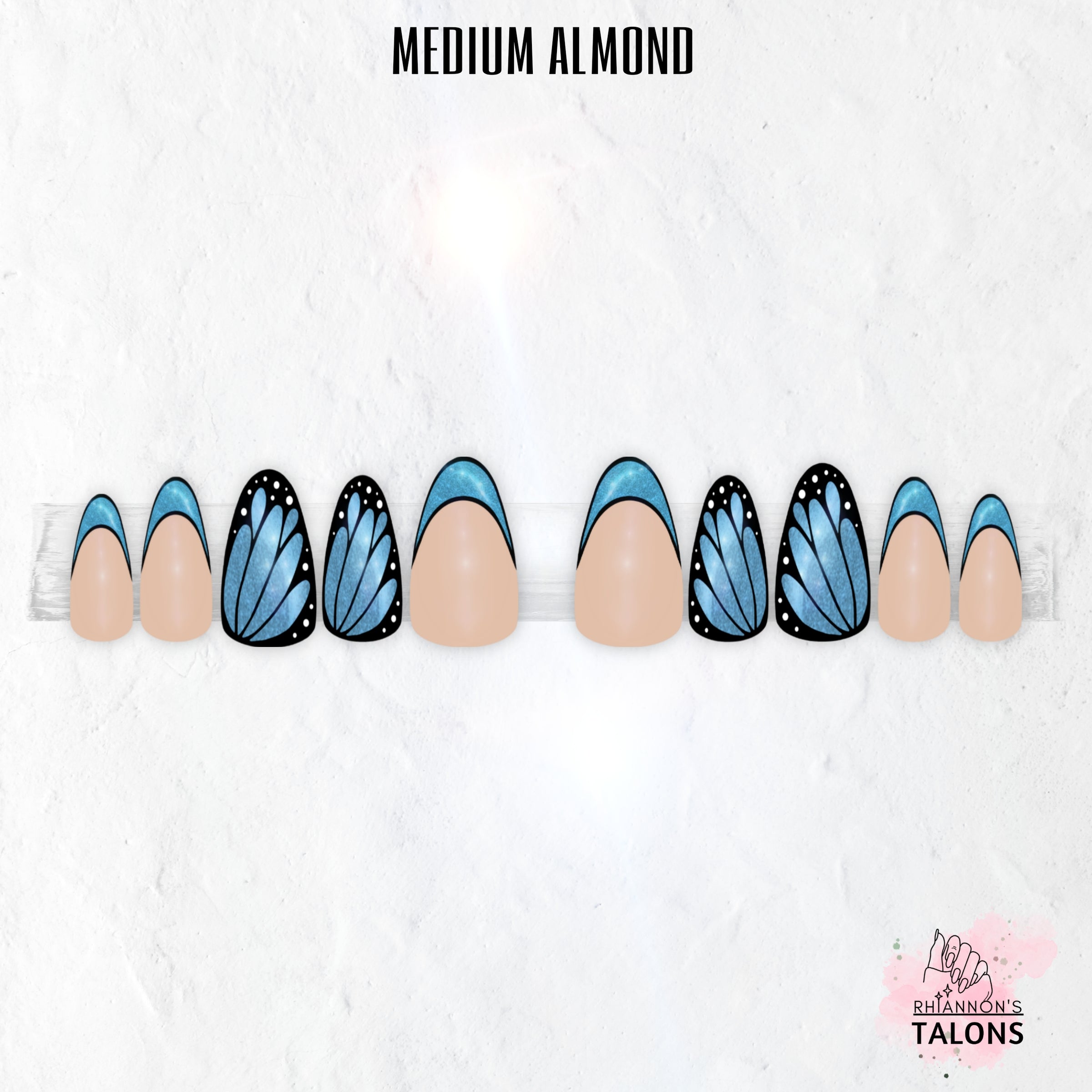 Flutterfly butterfly wing press-on nails with nude base, black wing nail art, shimmer colour accents and glossy medium almond false nails.