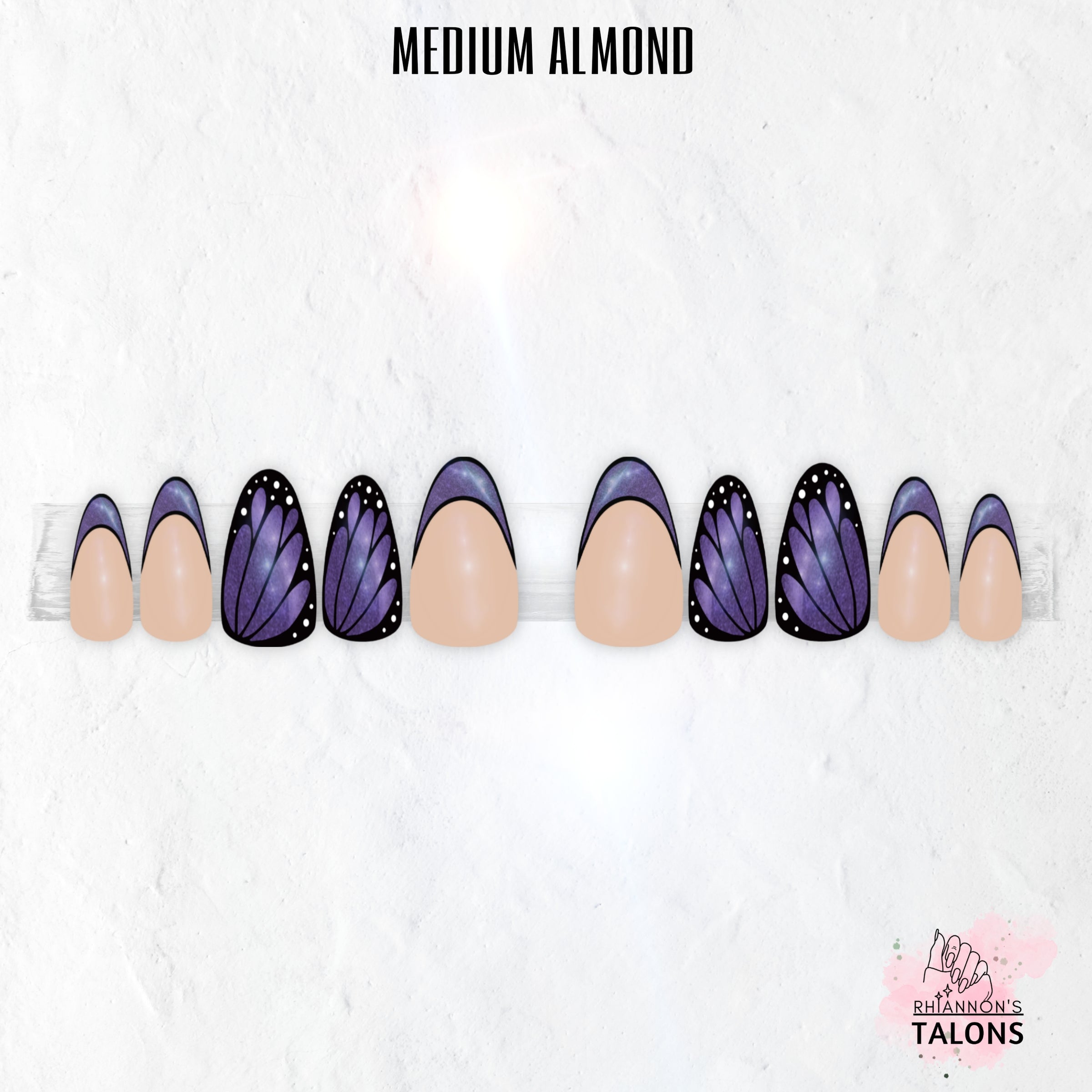 Flutterfly butterfly wing press-on nails with nude base, black wing nail art, shimmer colour accents and glossy medium almond false nails.