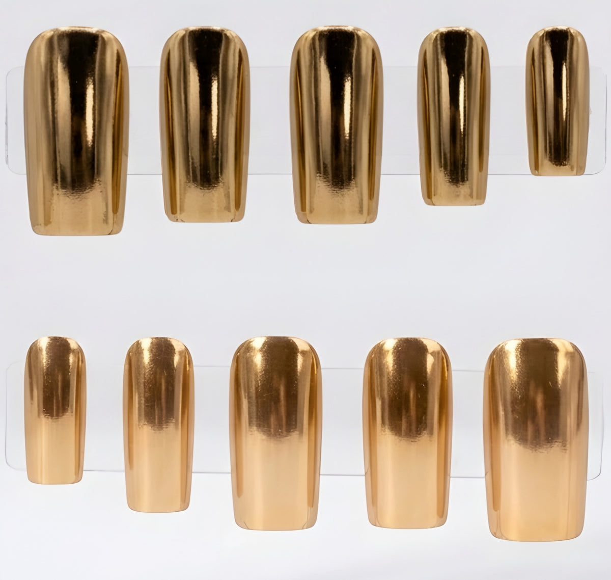 Ten metallic gold chrome press-on nails arranged in two rows on a clear display stand against a white background.