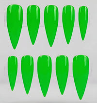 Ten bright neon green stiletto-shaped press-on nails arranged in two rows on a white background.