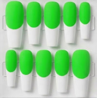 A set of ten press-on nails with a bright neon green and white French tip design, arranged in two rows on a clear plastic display tray.