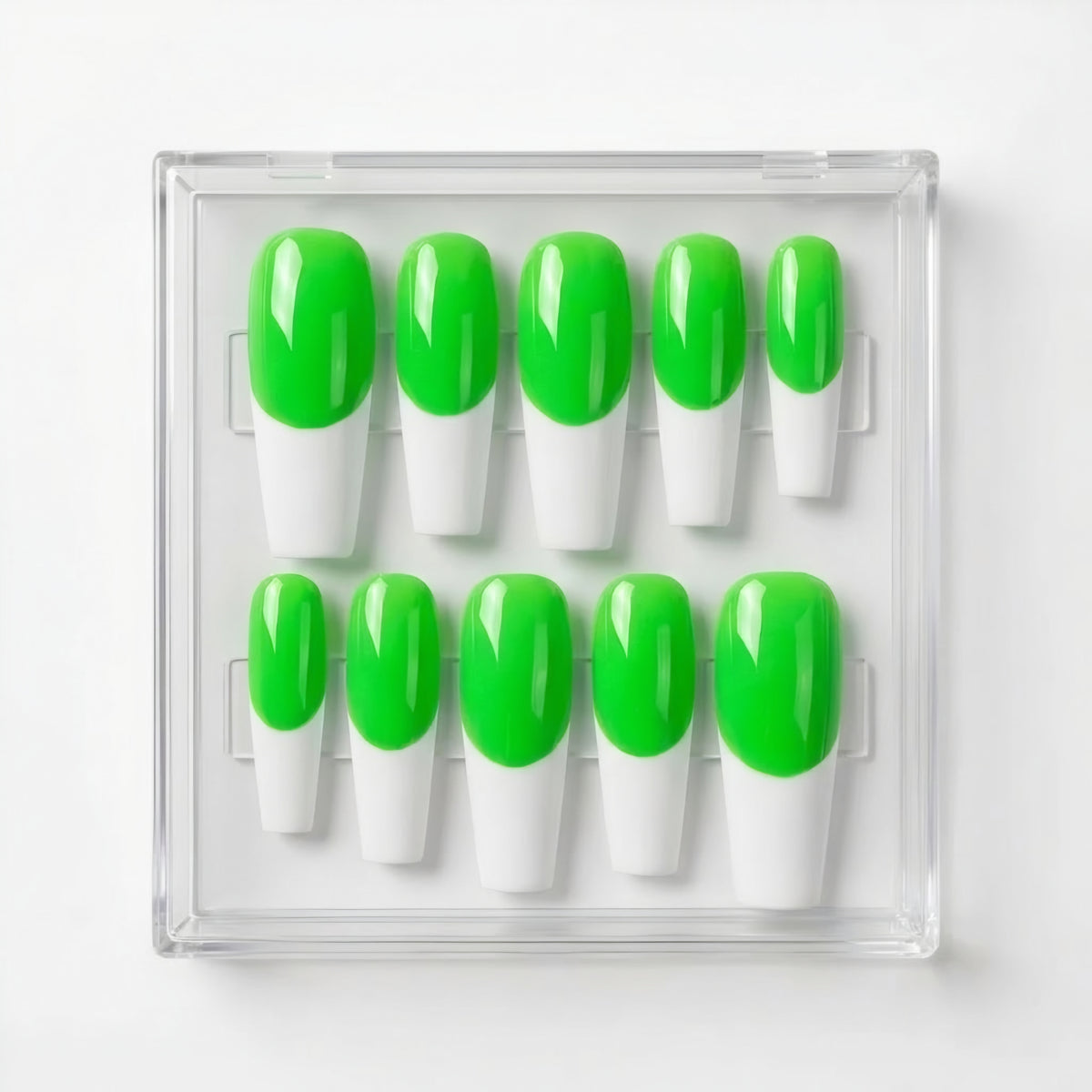 Ten press-on nails in a clear plastic case, featuring a neon green and white French tip design.