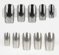Ten metallic silver chrome press-on nails displayed on clear plastic stands against a white background.