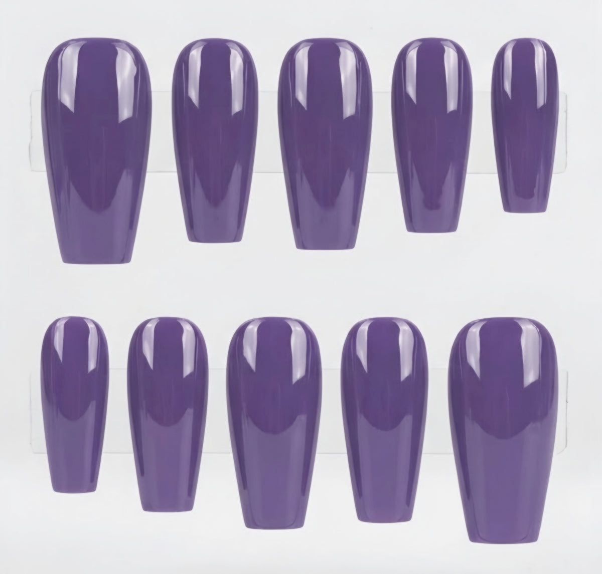 A set of ten glossy purple press-on nails arranged in two rows on a white background.