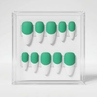 A set of ten false press-on nails displayed in a clear acrylic case, featuring a two-tone design with a matte mint green base and white french tips.