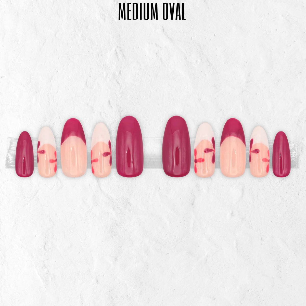 Petal Pop pink floral press-on nails with hot pink, blush pink, white flower nail art and glossy medium oval false nails.