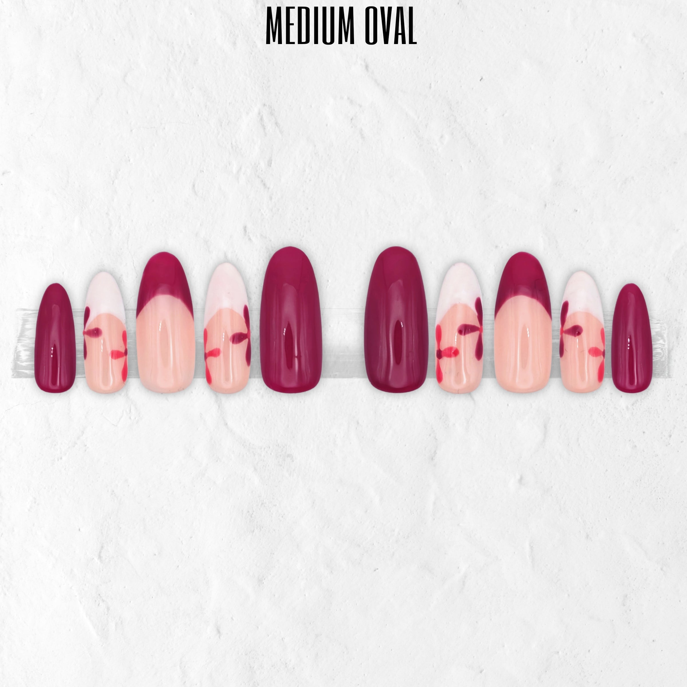 Petal Pop pink floral press-on nails with hot pink, blush pink, white flower nail art and glossy medium oval false nails.