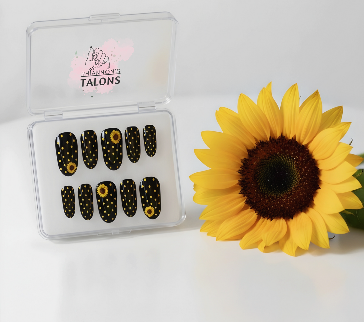 Dotty for Sunflowers black and yellow polka dot press-on nails with sunflower nail art