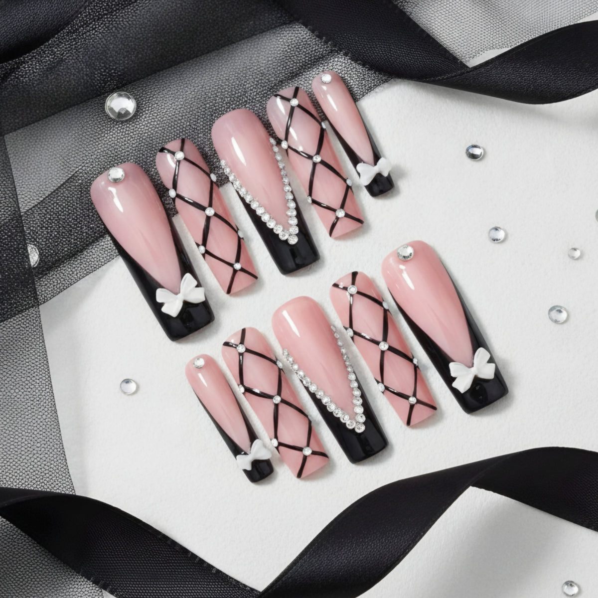 Black Tie Barbie pink and black press-on nails with crystals and 3D bow nail art