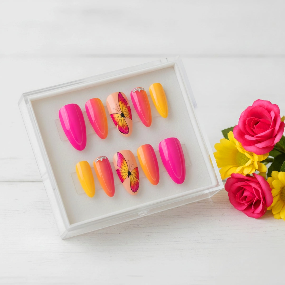 Paradise Wings pink and yellow butterfly press-on nails with tropical nail art