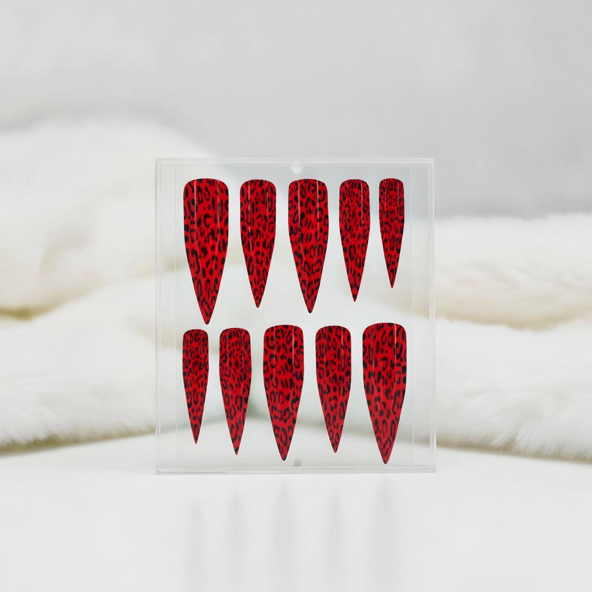 Ruby Roar red leopard print press-on nails with black animal print nail art