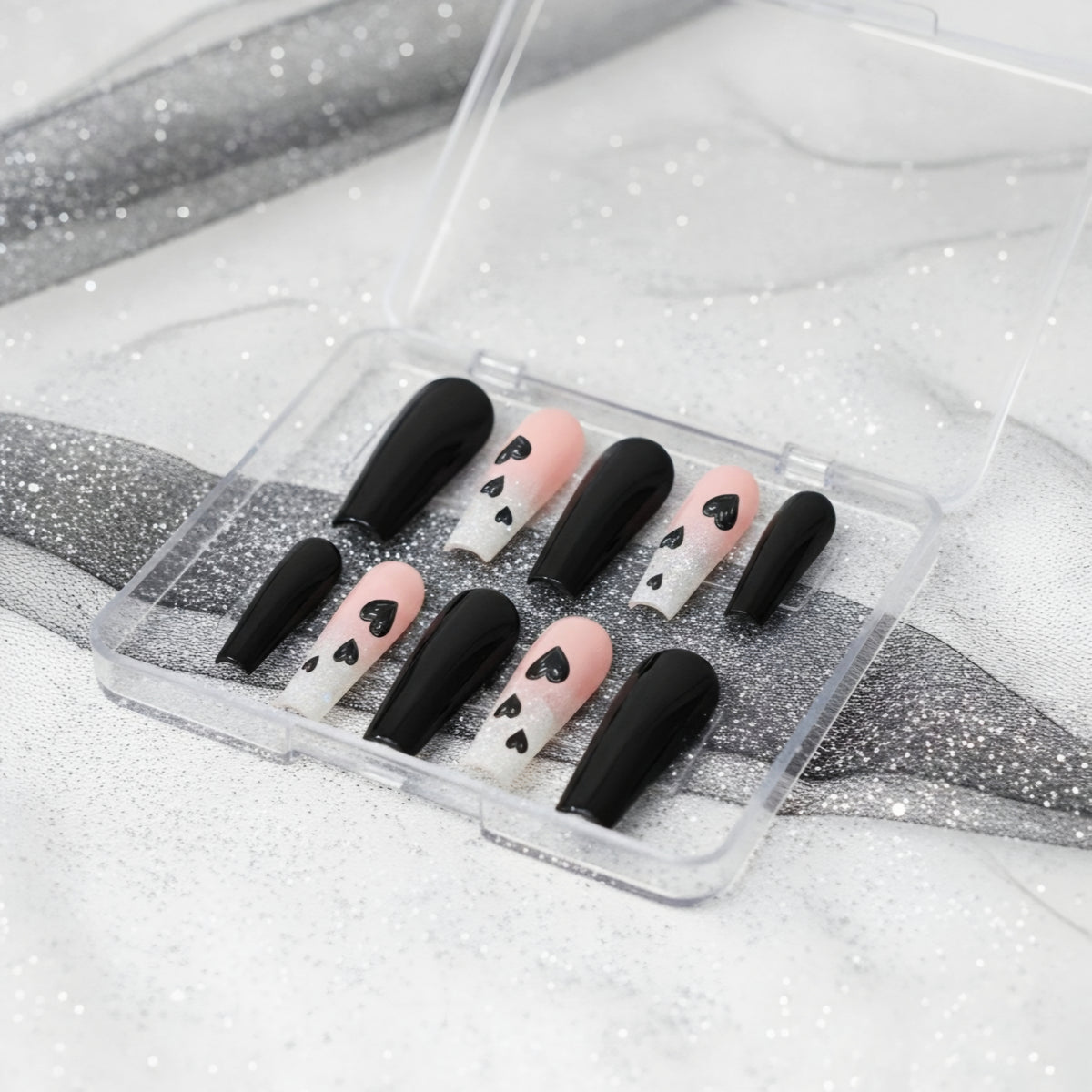 Secret Admirer black and pink press-on nails with silver glitter and heart nail art