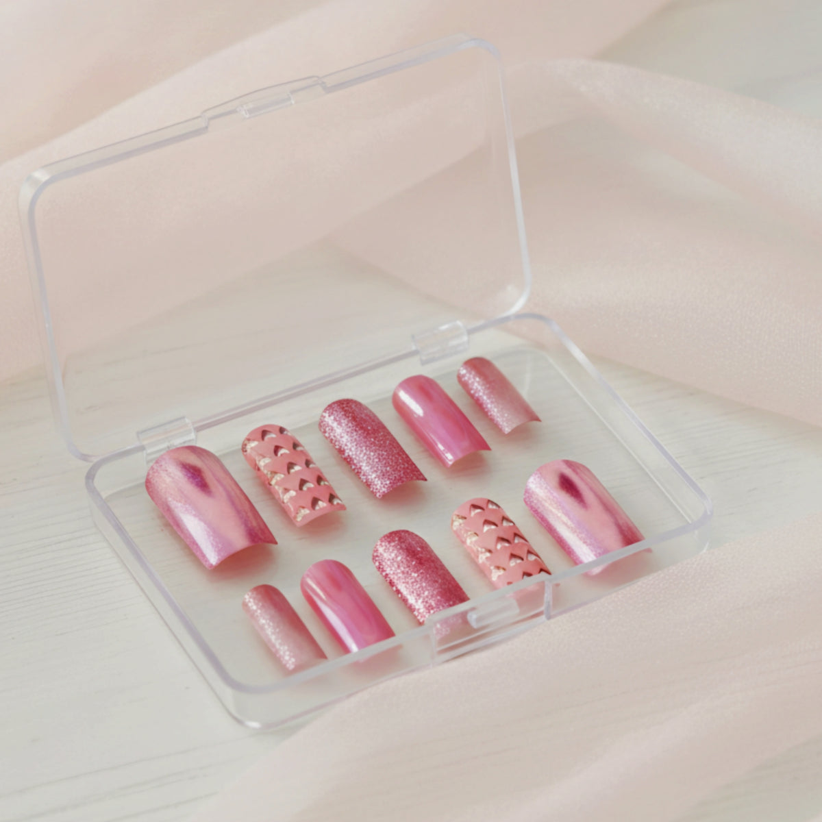 Cutie Pie pink press-on nails with glitter, chrome and heart nail art