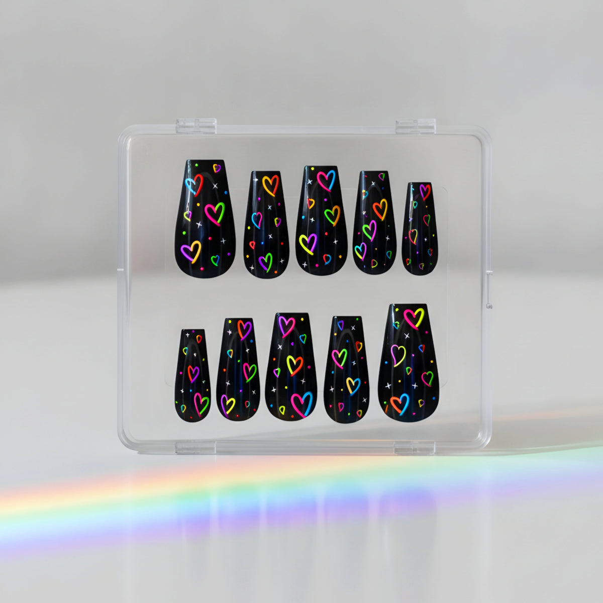 Neon Love black press-on nails with neon hearts and star nail art