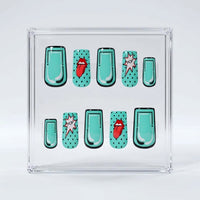 A set of square press on nails displayed inside a clear square acrylic box on a light gray background. The design features a repeating pattern of mint green nail shapes with black polka dots, outlined in black, and two mint green nails with red Rolling Stones tongue-and-lips motifs and black polka dots.