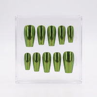 A set of ten metallic olive green chrome press-on nails arranged in two rows inside a clear acrylic display box, photographed against a clean white background.