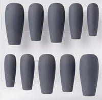 Ten matte dark gray coffin-shaped press-on nails arranged in two rows of five on a white background.