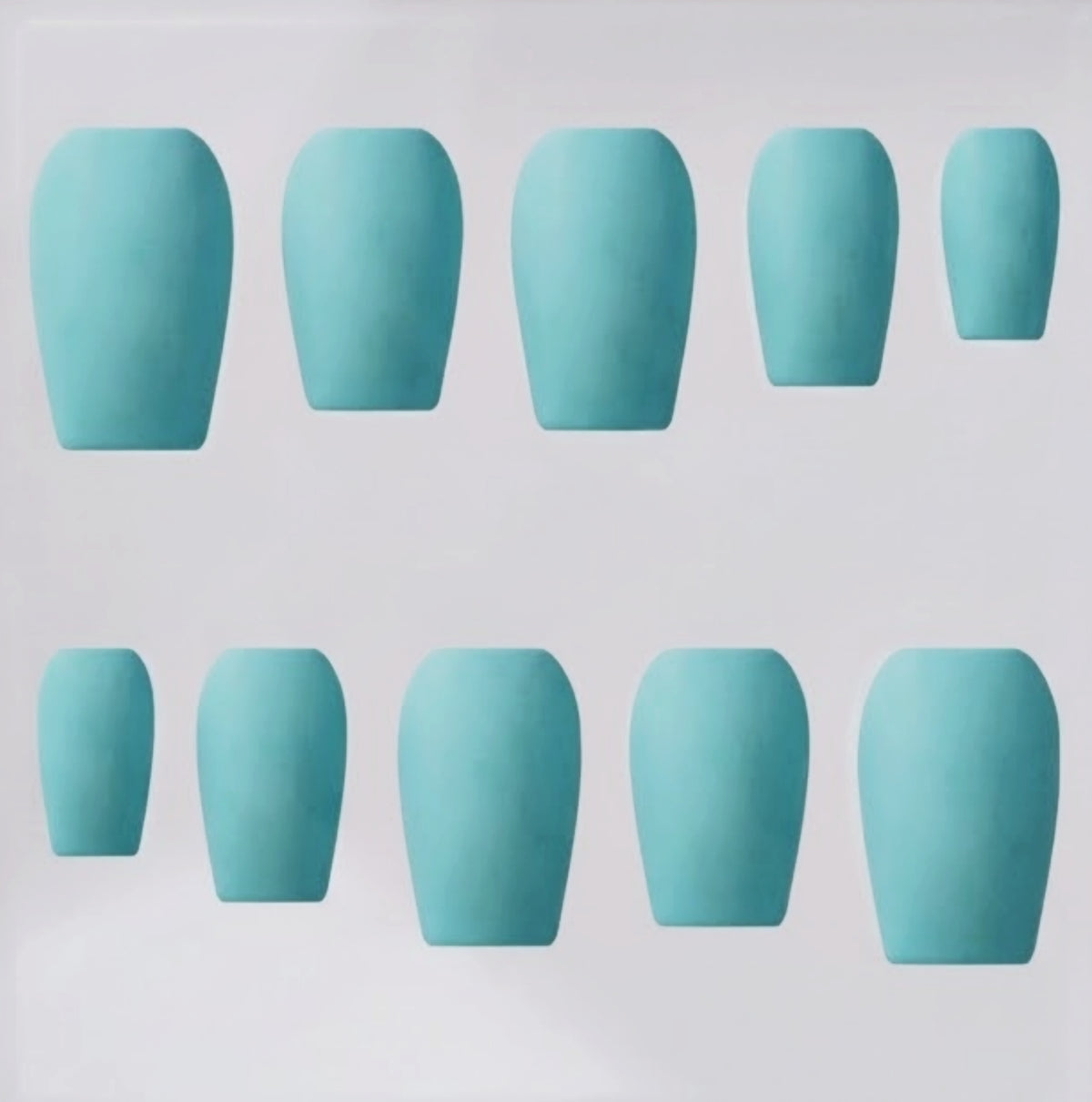Ten aqua blue press-on nails in a short coffin shape, shown in two rows against a plain light gray background.