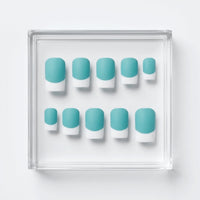 A set of ten false press-on nails with a light blue/turquoise and white French tip design, arranged inside a clear square acrylic display tray on a white background.