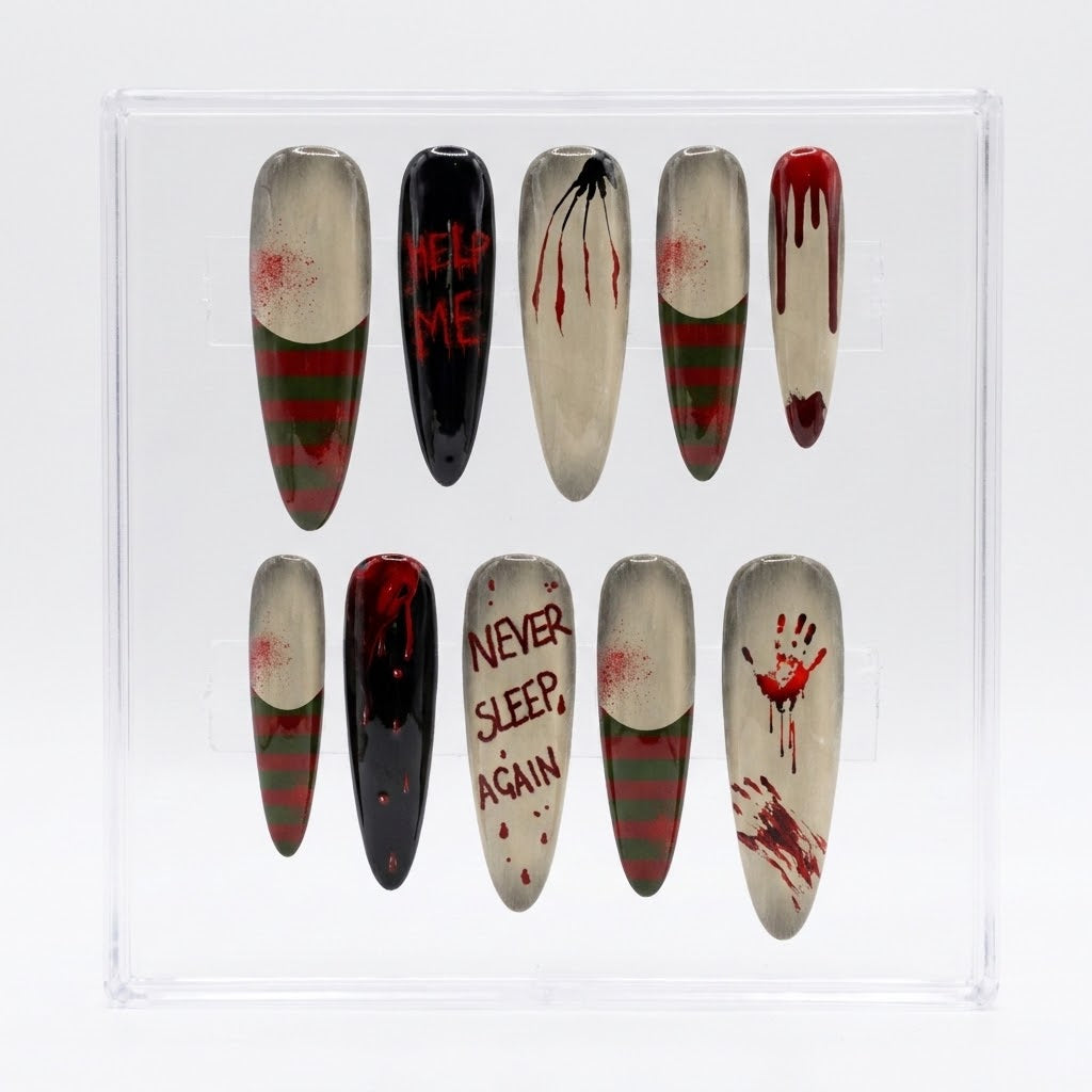 A set of ten almond Halloween press-on nails displayed in a clear plastic case. The nails feature horror movie designs including blood splatters, bloody stripes, handprints, and text reading 'HELP ME', 'NEVER SLEEP AGAIN', and 'DIE FOR ME'.