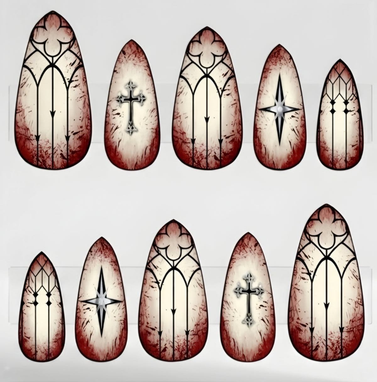 Ten almond-shaped press on nails  in two rows on a light gray background. Each nail features a distressed, stained-glass style design with a cream center, dark red stained-glass effect around the edges, and black gothic window line art.