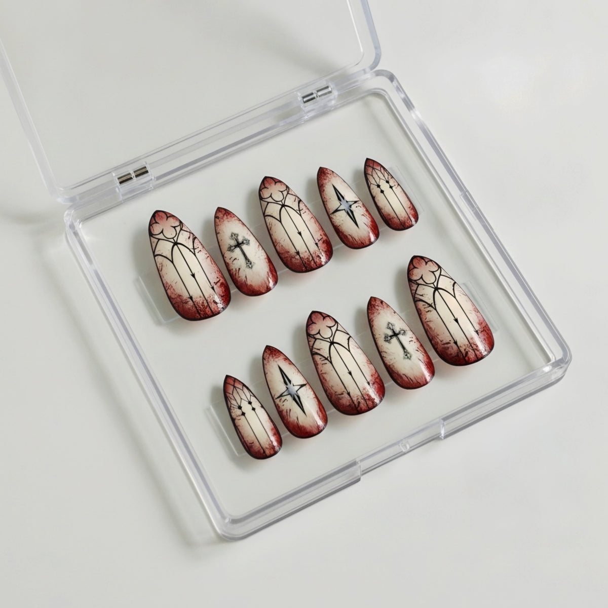 The Sinner gothic Halloween press-on nails with aged ivory, blood-red and black cathedral nail art