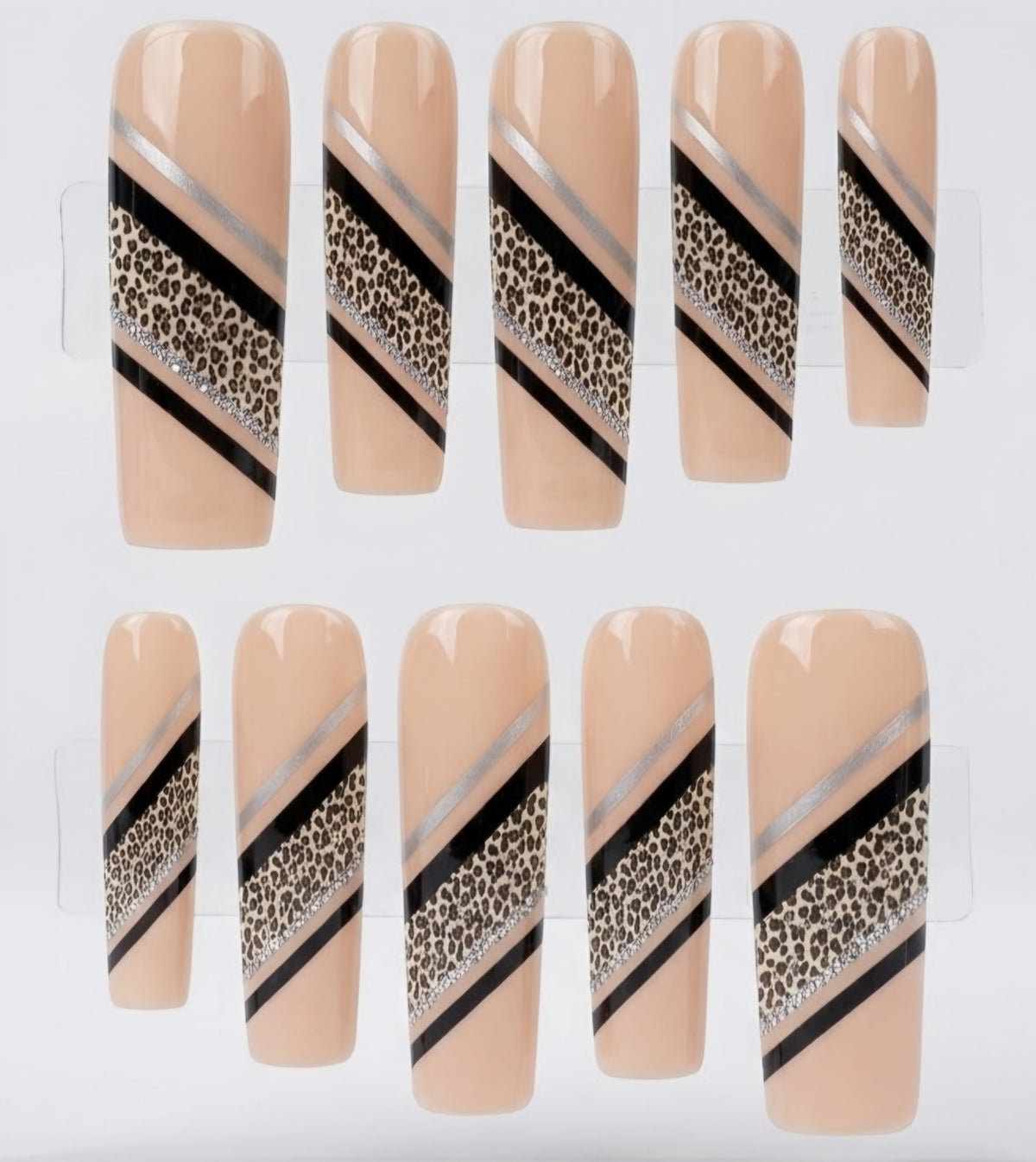 Ten press-on nails displayed on a clear plastic hanger against a white background. The nails have a nude beige base with diagonal stripes in black, metallic silver, and a leopard print pattern.