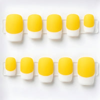 Ten false press-on nails arranged in two rows on a white background, featuring a yellow and white French tip design.